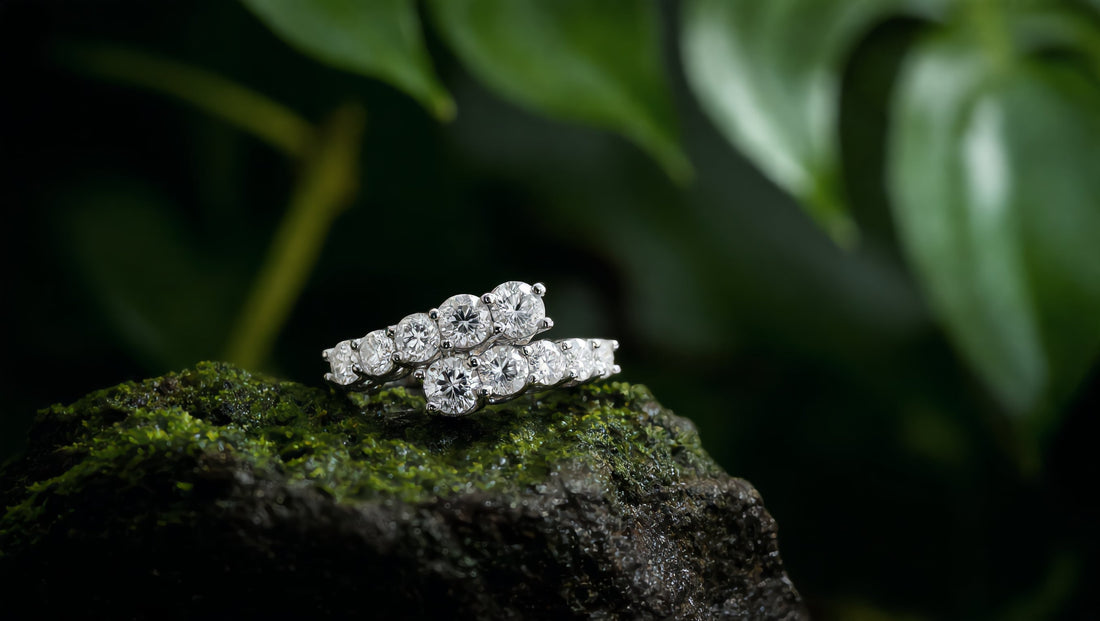 The Orbit Ring with Moissanite in 925 Sterling Silver from Glacier & Aurealis on a stone in nature.