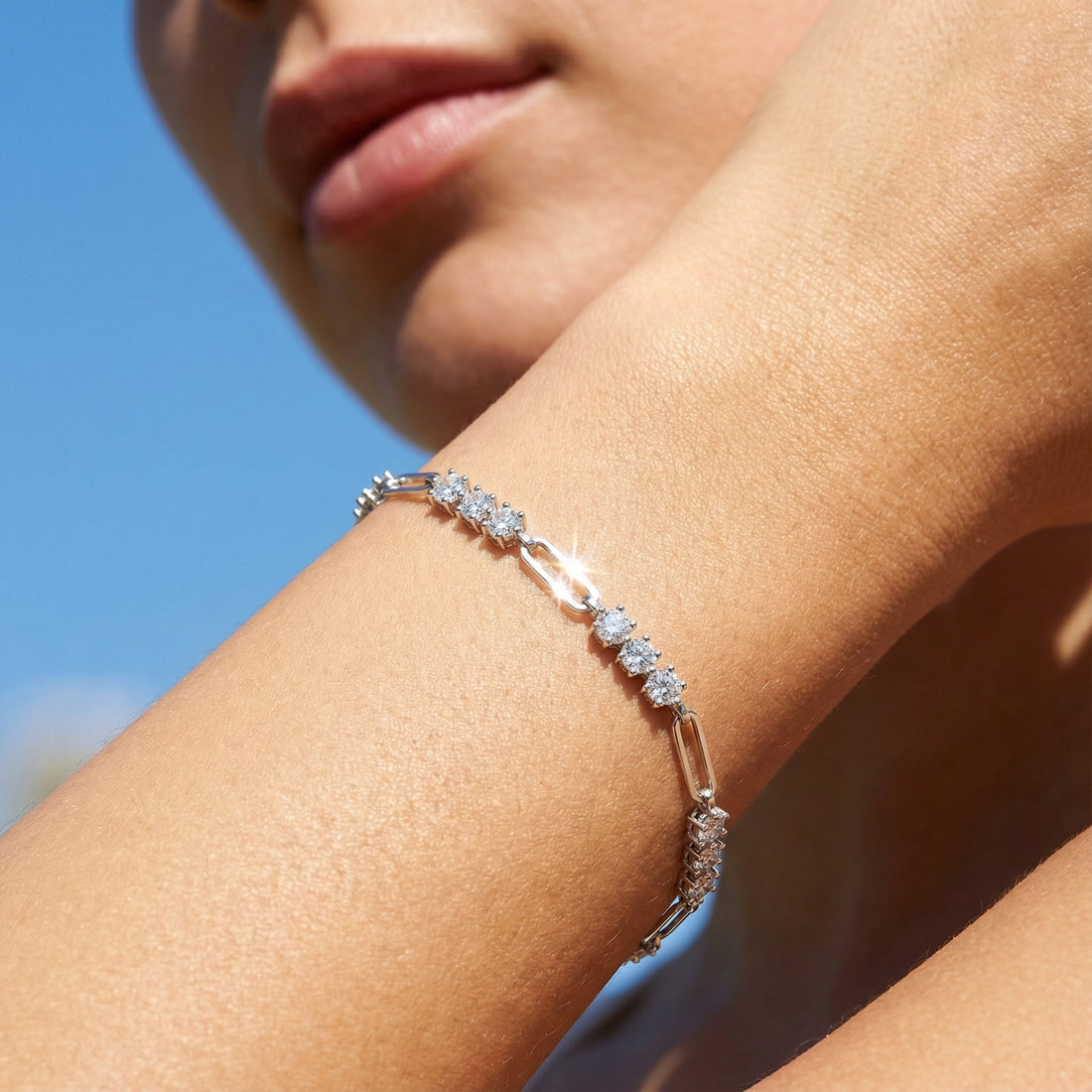 Rhodium-plated sterling silver bracelet worn on the wrist, designed for sensitive skin with hypoallergenic materials and a smooth, skin-safe finish.